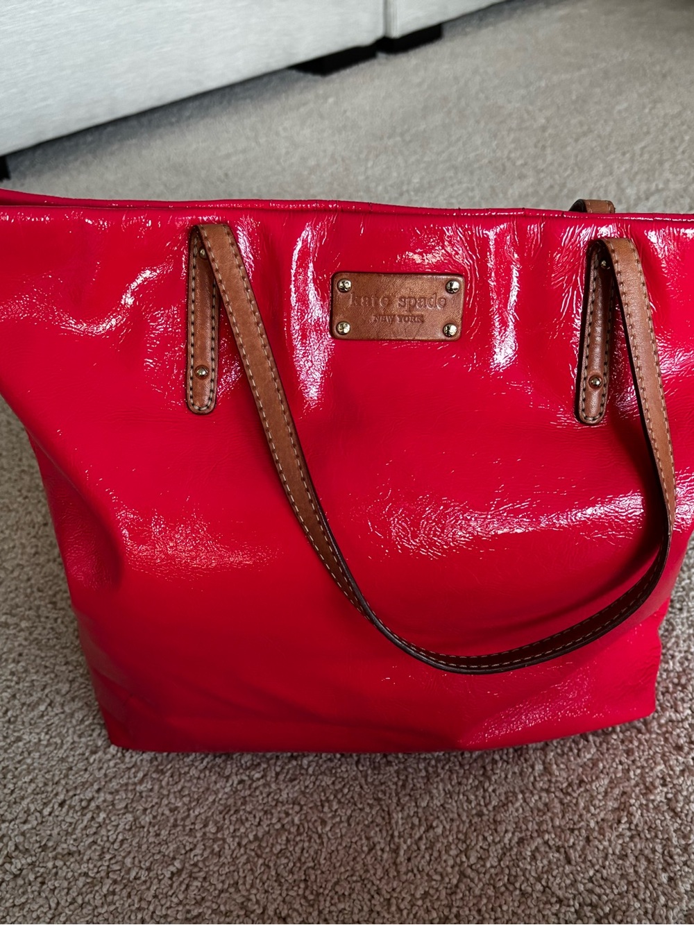 kate spade glossy vibrant pink tote with brown leather straps